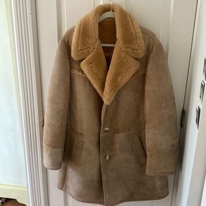 Suede Shearling Coat with Faux Fur. Knee length. Slit Pockets and Button Closure